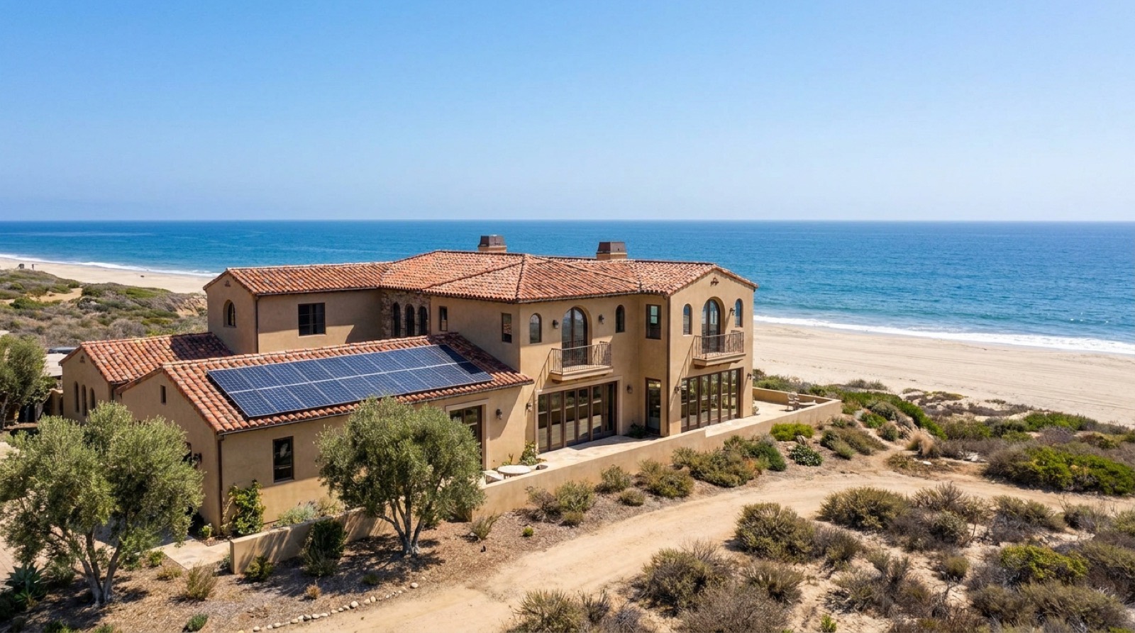 Mediterranean coastal estate with solar above the Pacific